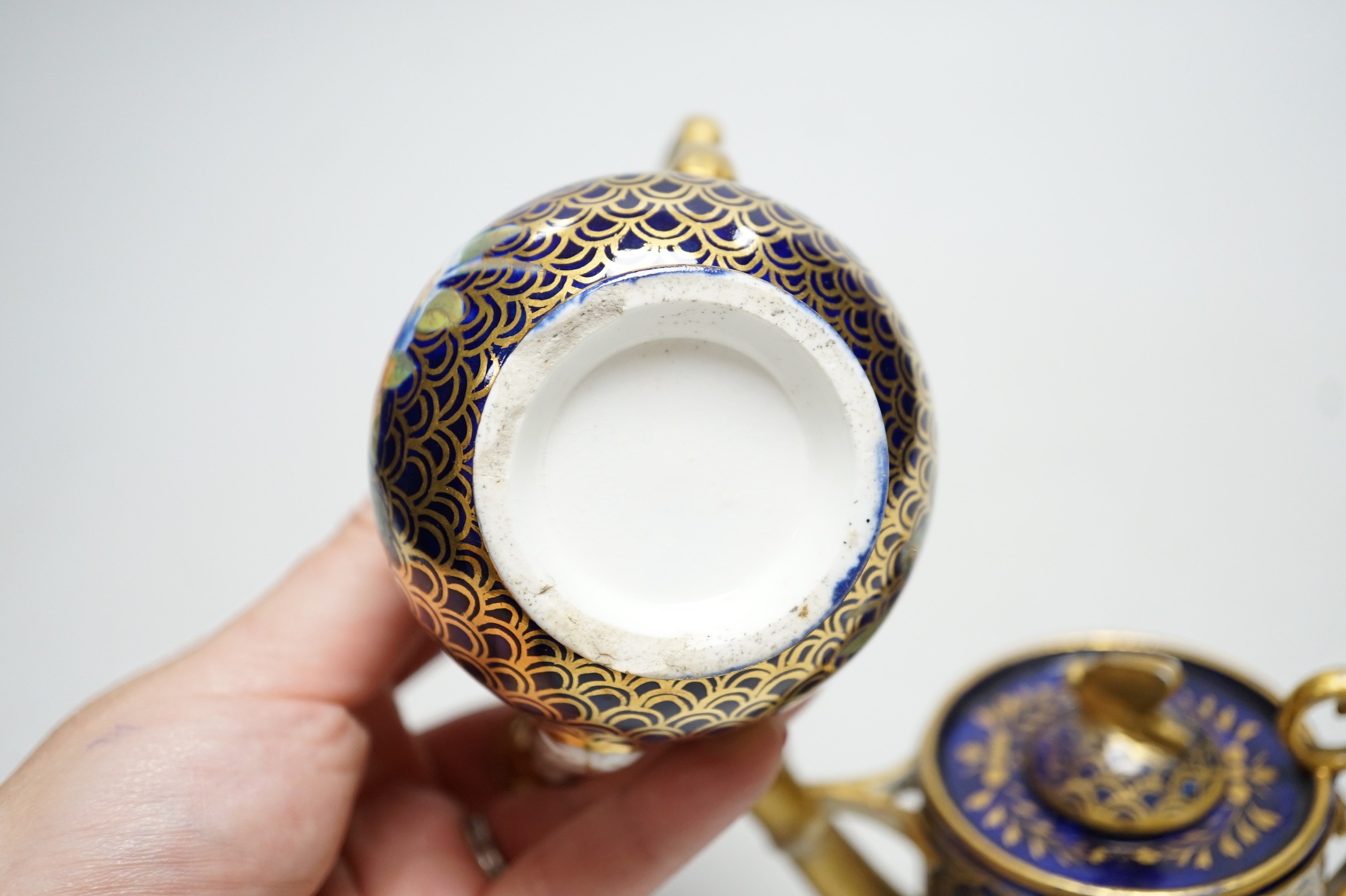 Toy porcelain: Two English rosewater scale ground sprinklers, c.1815-20, possibly Coalport, each modelled in the form of a watering can